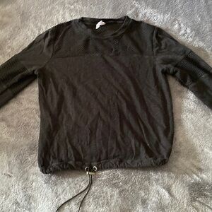 adjustable waist band crop with fish net pieces on arms and chest